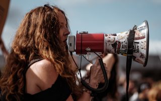 Female protester with megaphone