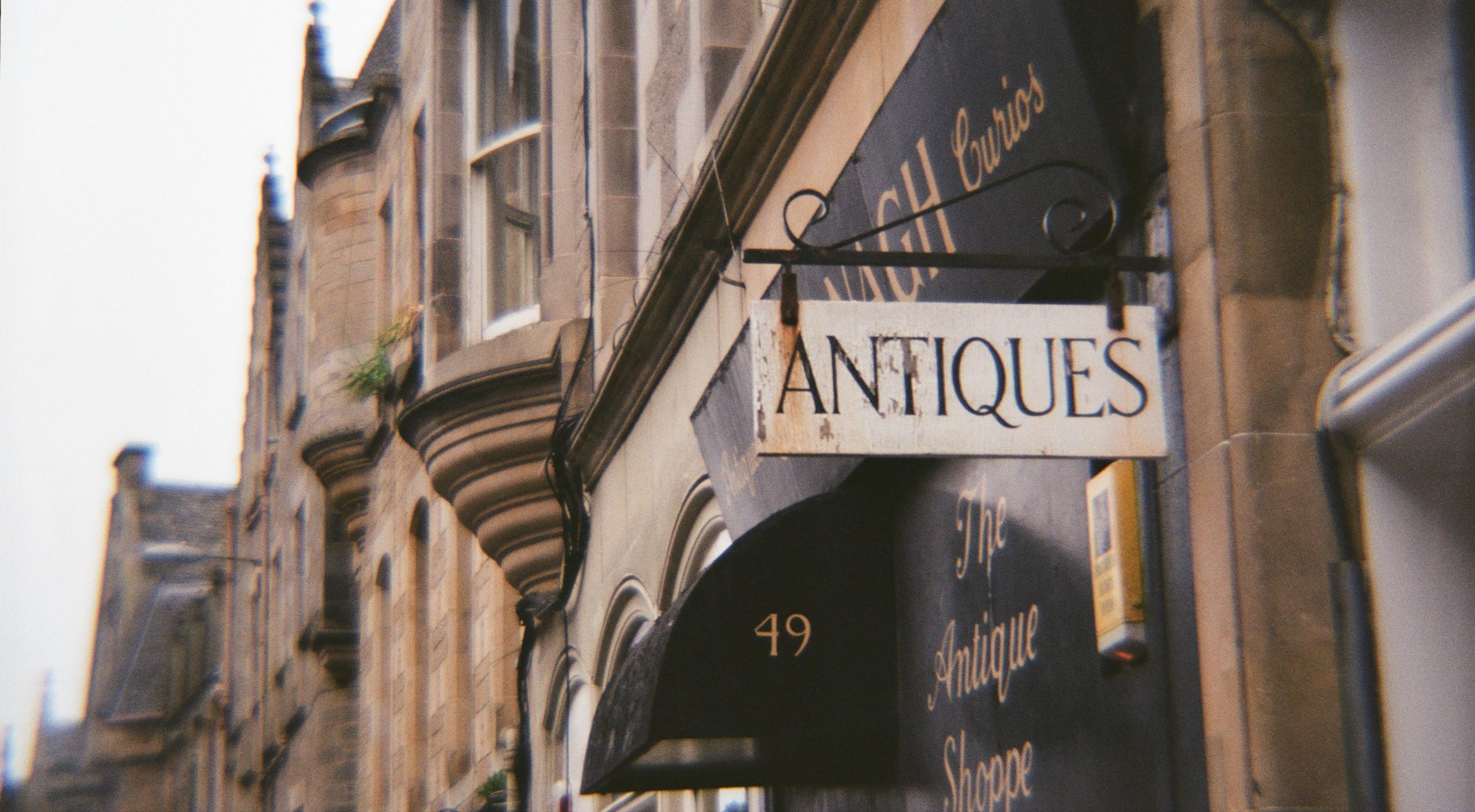 "Antiques" sign outside shop